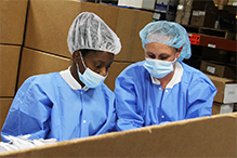 Employees creating custom medical kits
